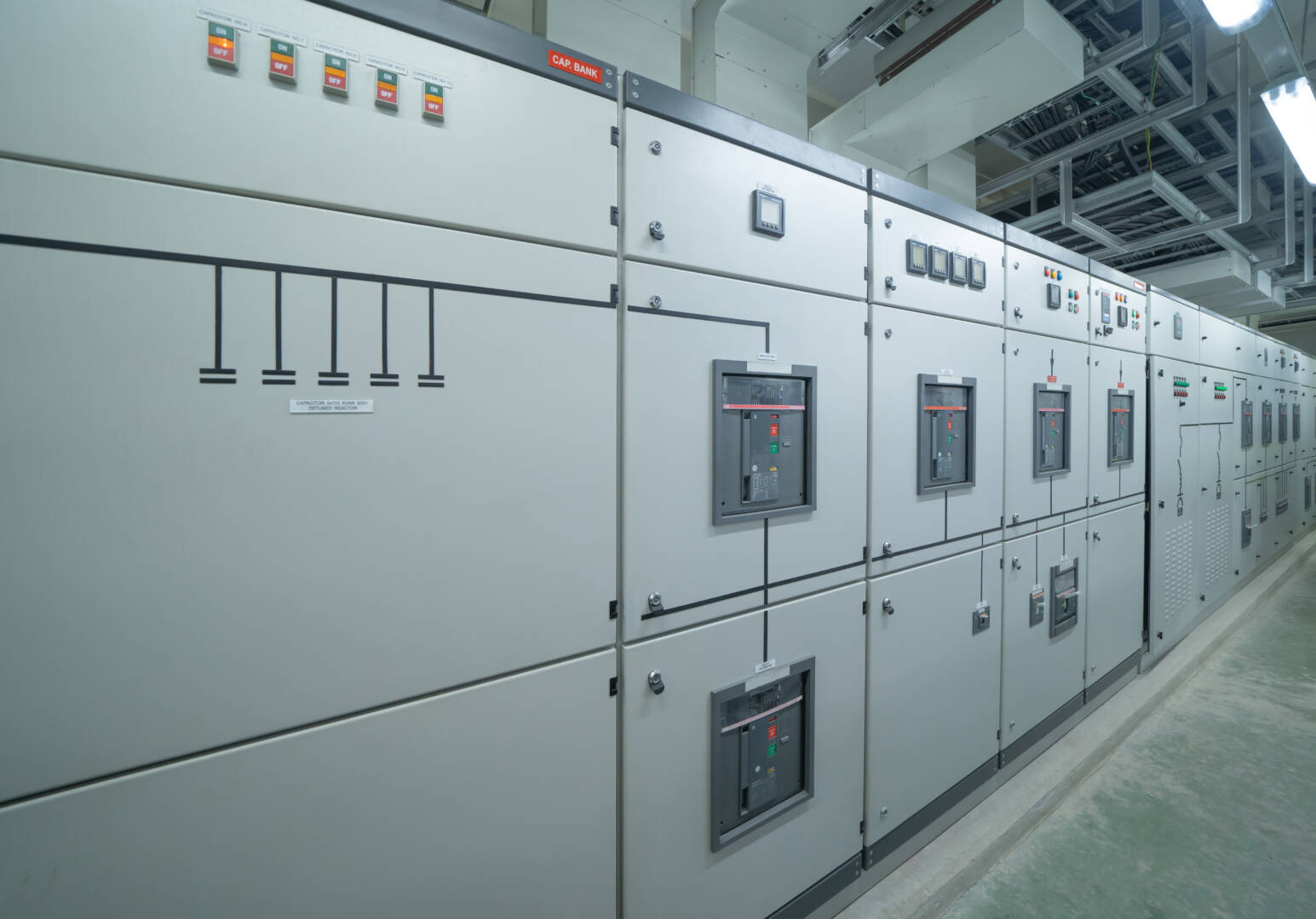 Interior of electrical room. Power energy motor machinery cabinets in control or server room, main operator station network and circuit center in industry factory manufacturing system. generator